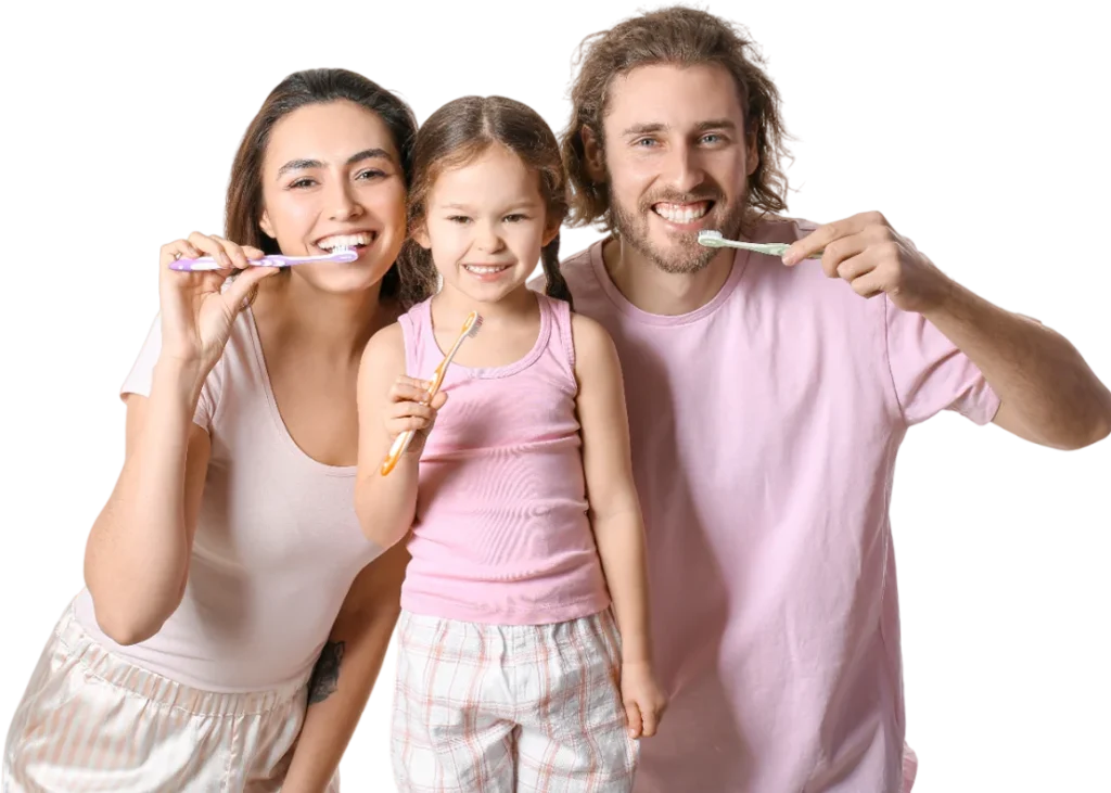 Little girl with her parents brushing teeth on white background