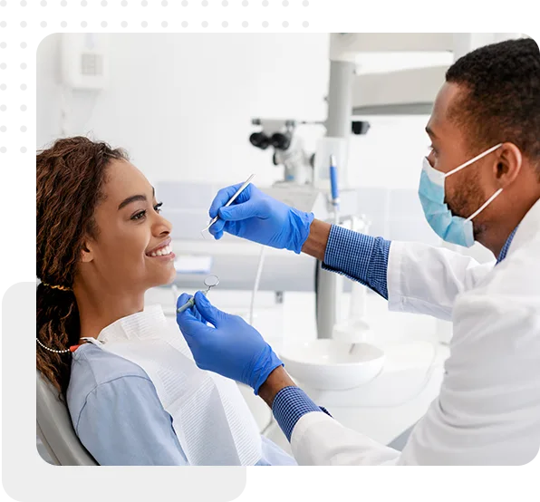 dentist checking patient's teeth